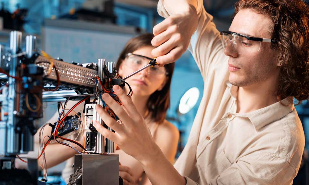 young-man-woman-protective-glasses-doing-experiments-robotics-laboratory-robot